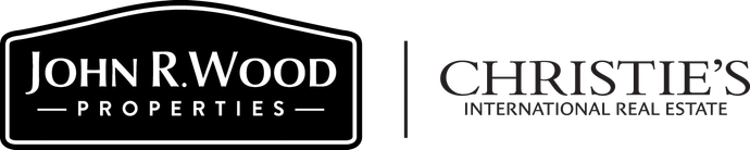 The logo for john r. wood properties and christies international real estate