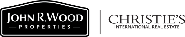 The logo for john r. wood properties and christies international real estate