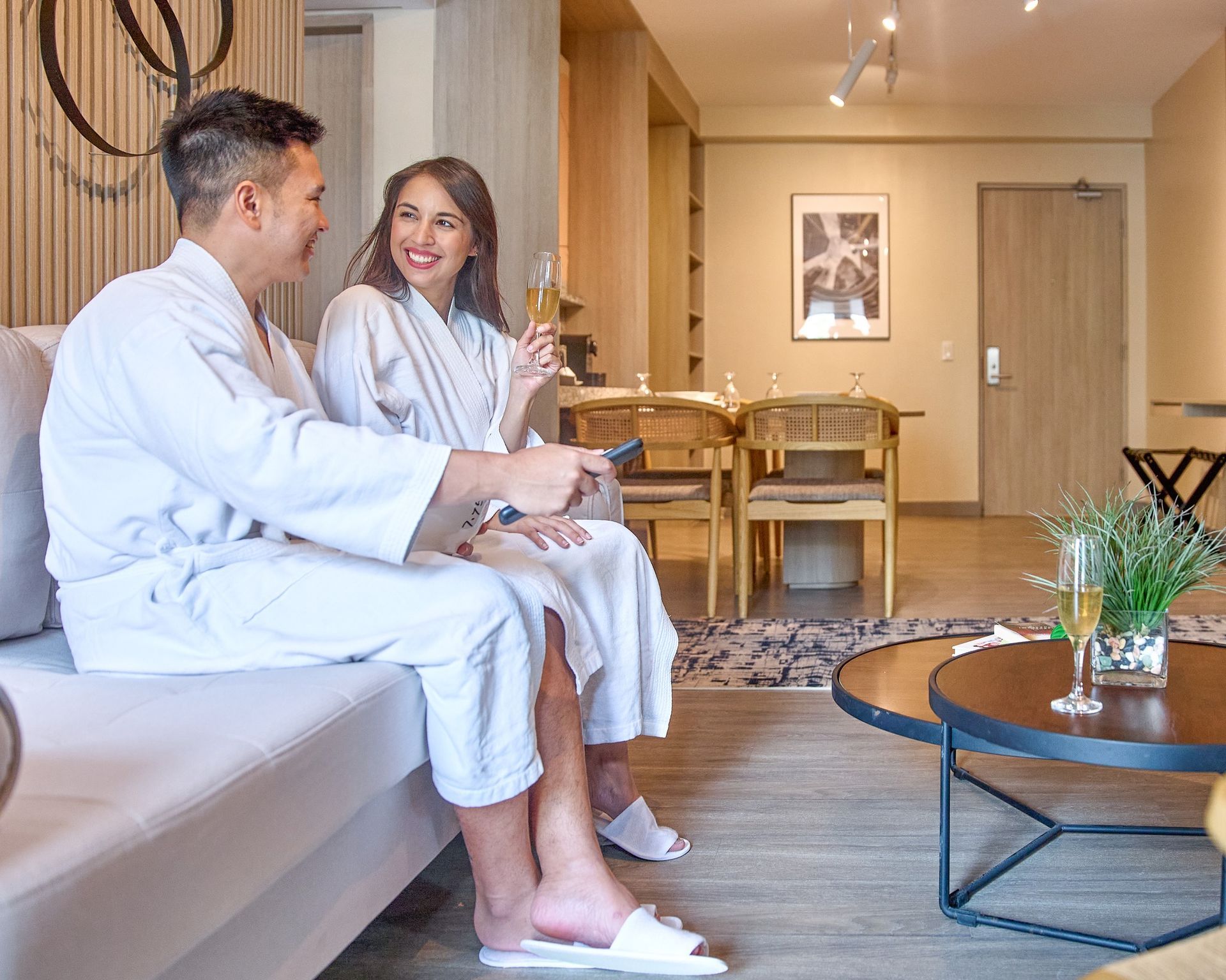 A couple enjoying a cozy and comfortable stay at The Connor, one of the best hotels in San Juan, Metro Manila, for a relaxing escape.
