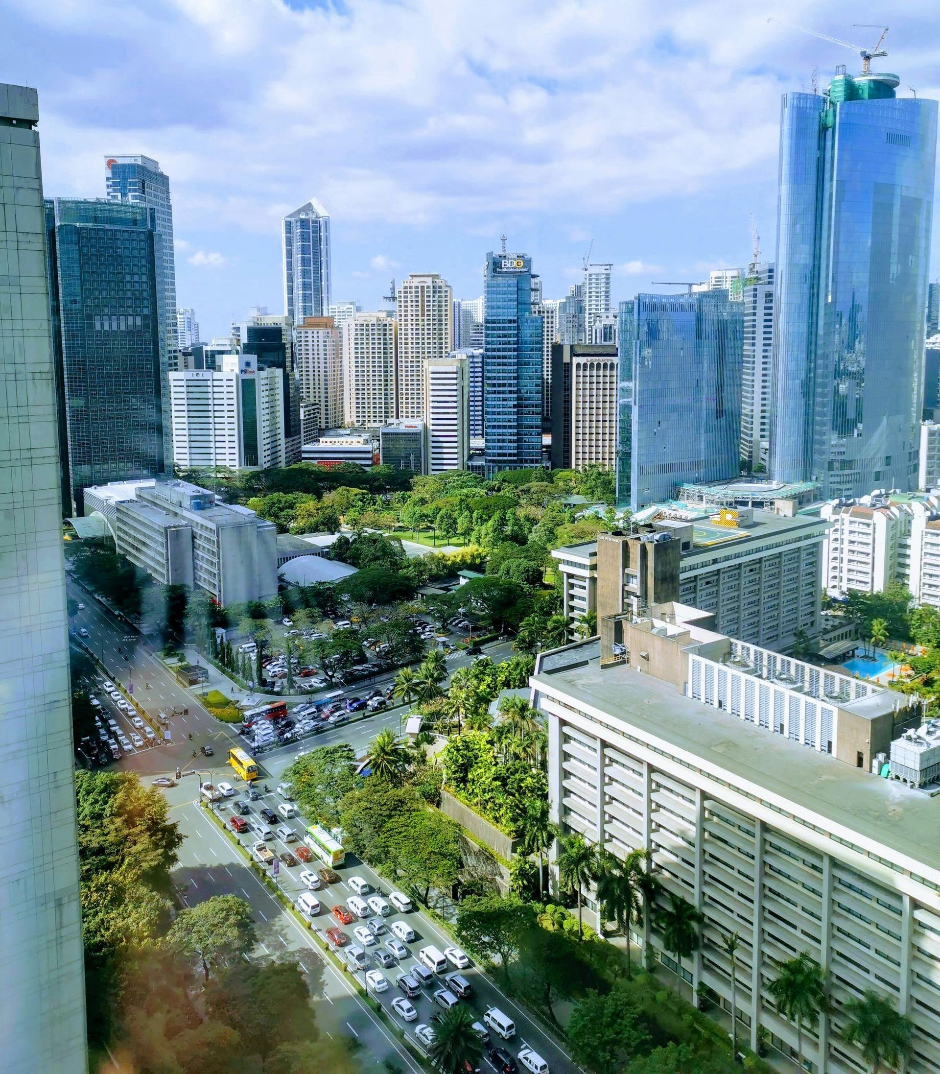 An aerial view of a city with lots of buildings and trees