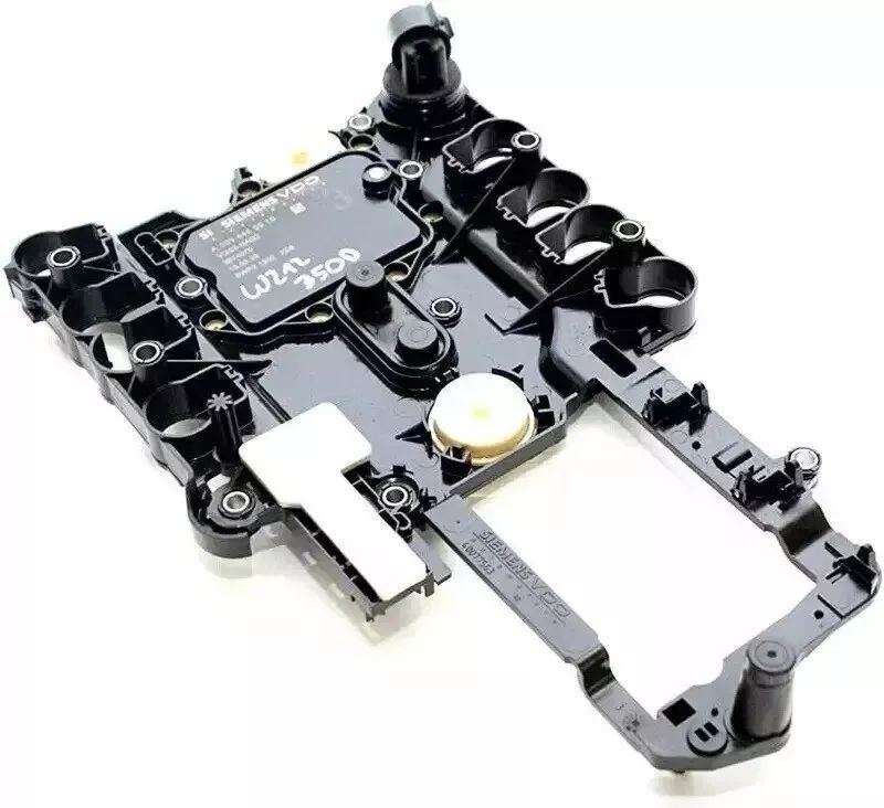 A close up of a black electronic device on a white surface.