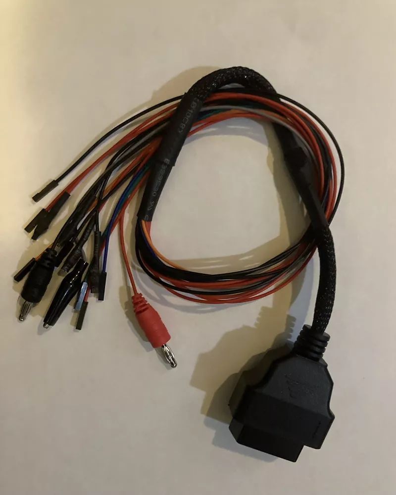 A bunch of wires and connectors on a white surface
