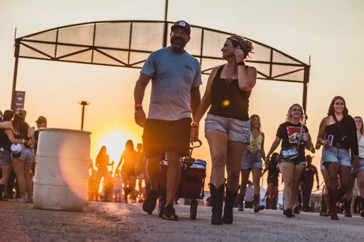Country music fans in cowboy hats at festival
