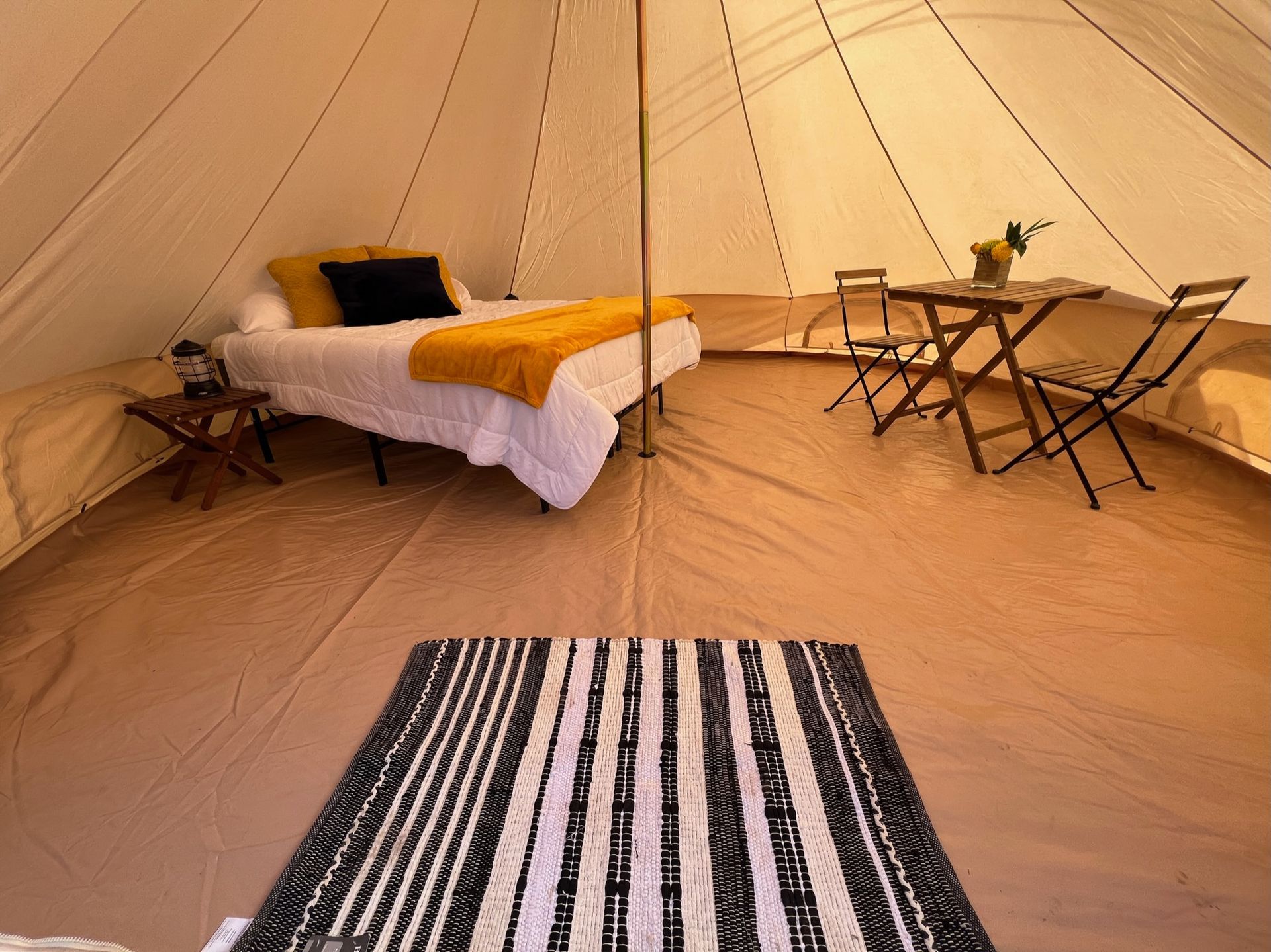 Luxury glamping tent interior with bed