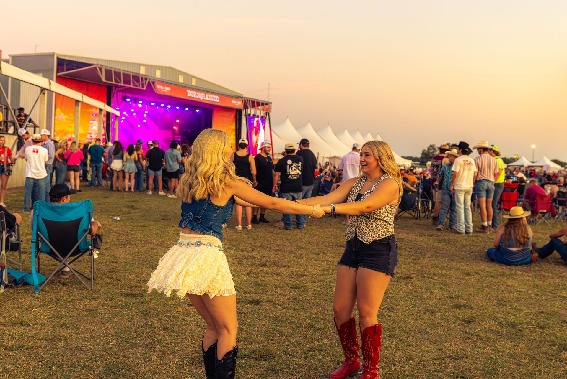Couple at country music festival crowd