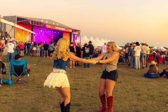 Couple at country music festival crowd