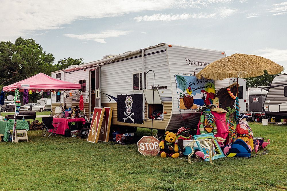 Festival campsite with decorated RV trailer