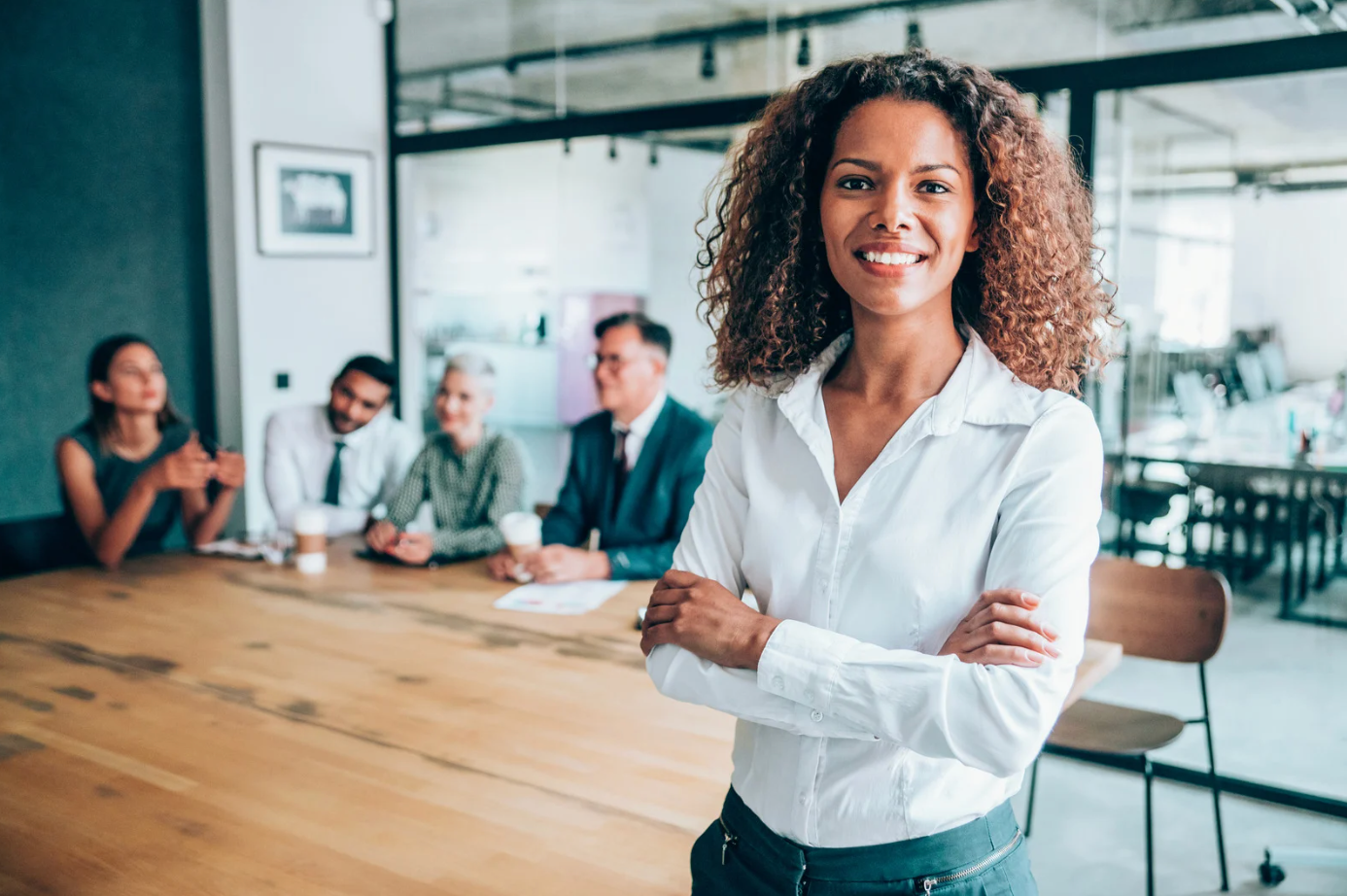 A nurse and a doctor are looking at a laptop computer.