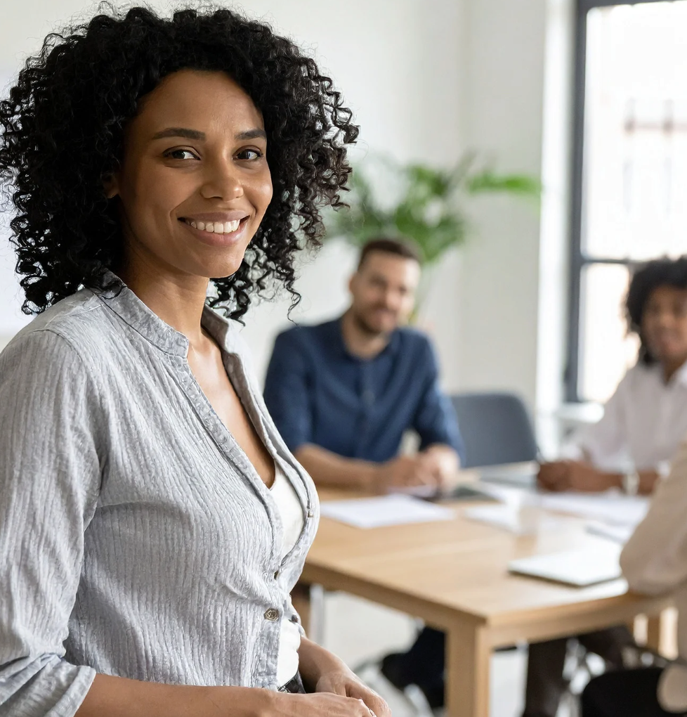 A man is sitting on the floor using a laptop computer.