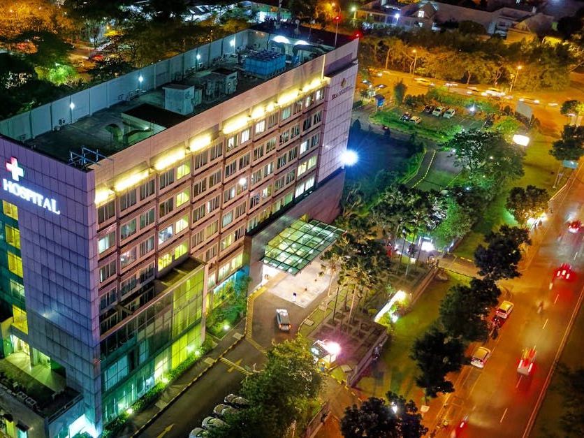 An aerial view of a hospital building at night.