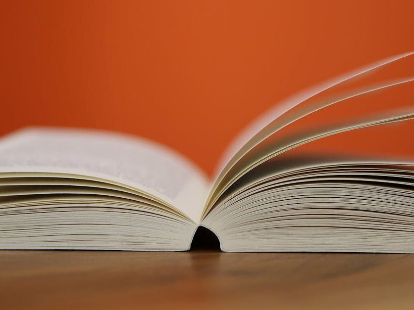 A close up of an open book on a table