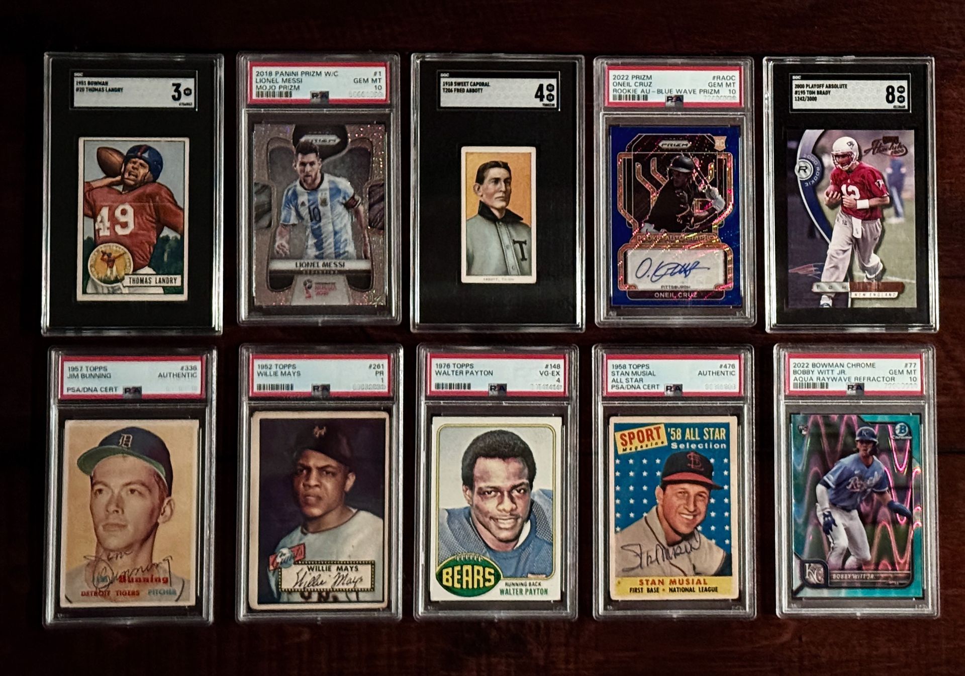 Vintage baseball cards in protective cases, depicting various players.