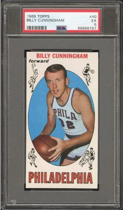 1969 Topps Billy Cunningham basketball card in a PSA holder; Cunningham in Philadelphia uniform, smiling, holding a basketball.