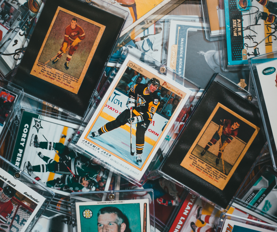 Hockey trading cards, varying colors, players in action, encased in protective holders.