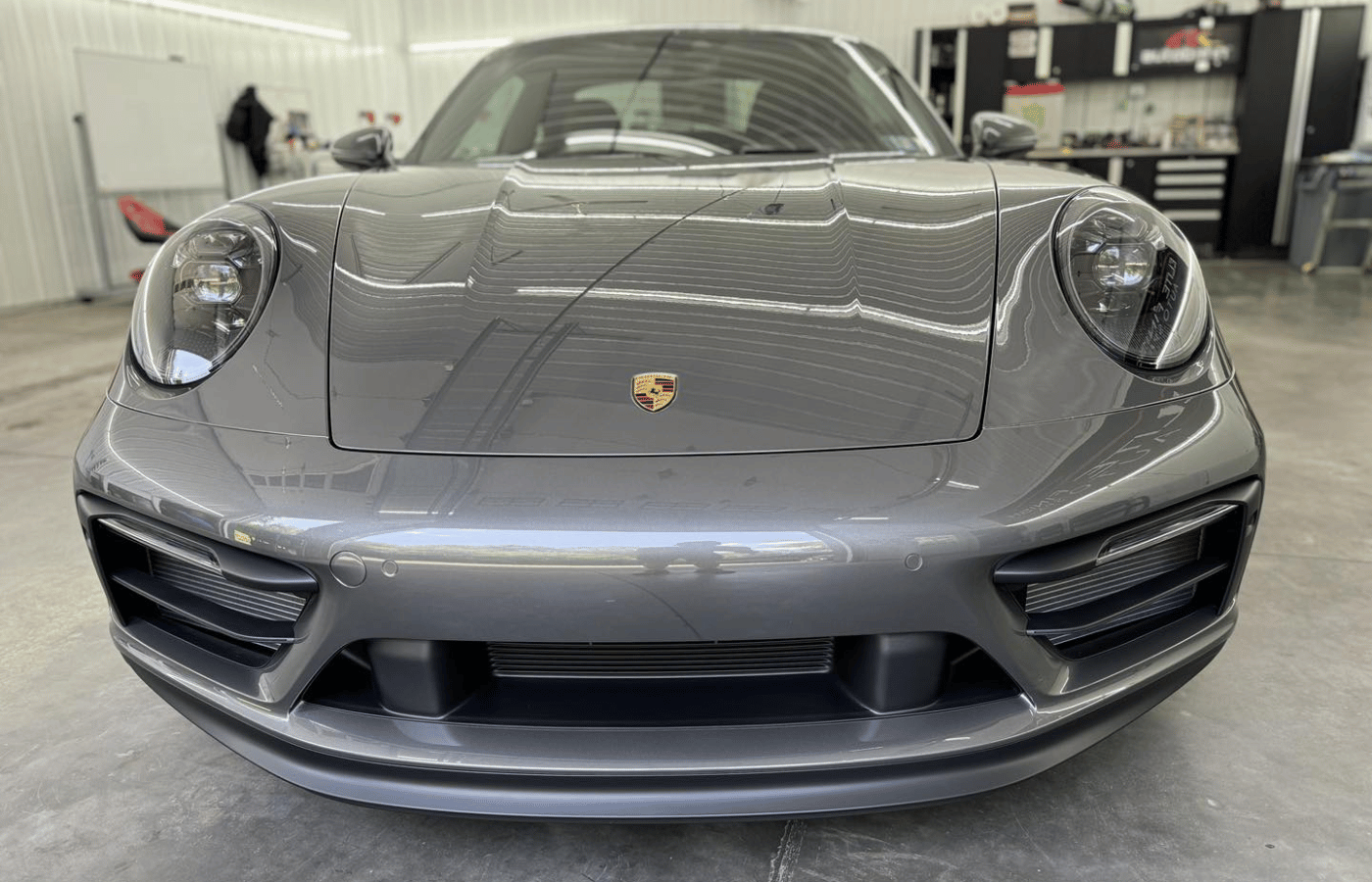 The back seat of a white suv with the door open.