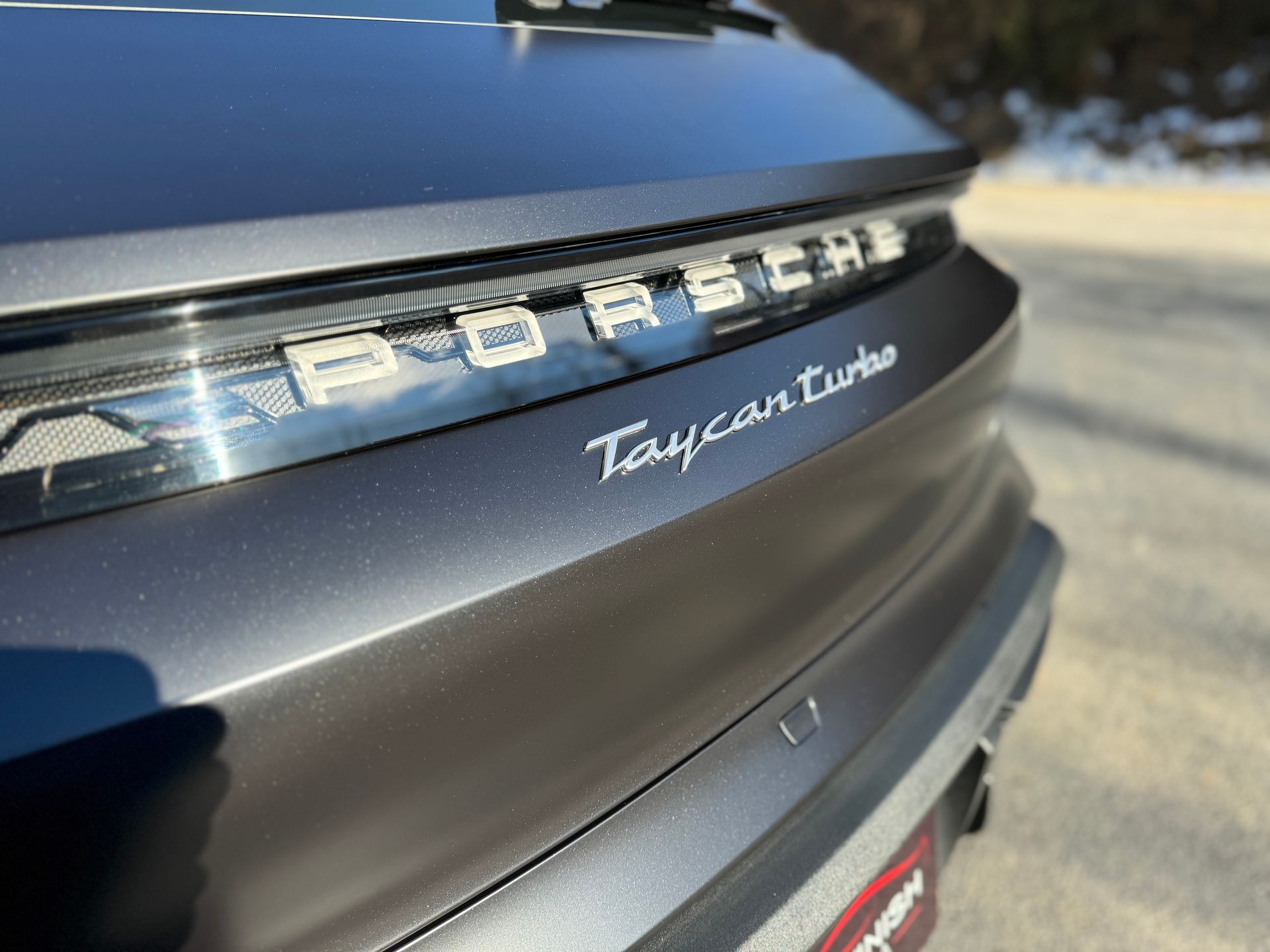 A close up of the back of a porsche taycan turbo