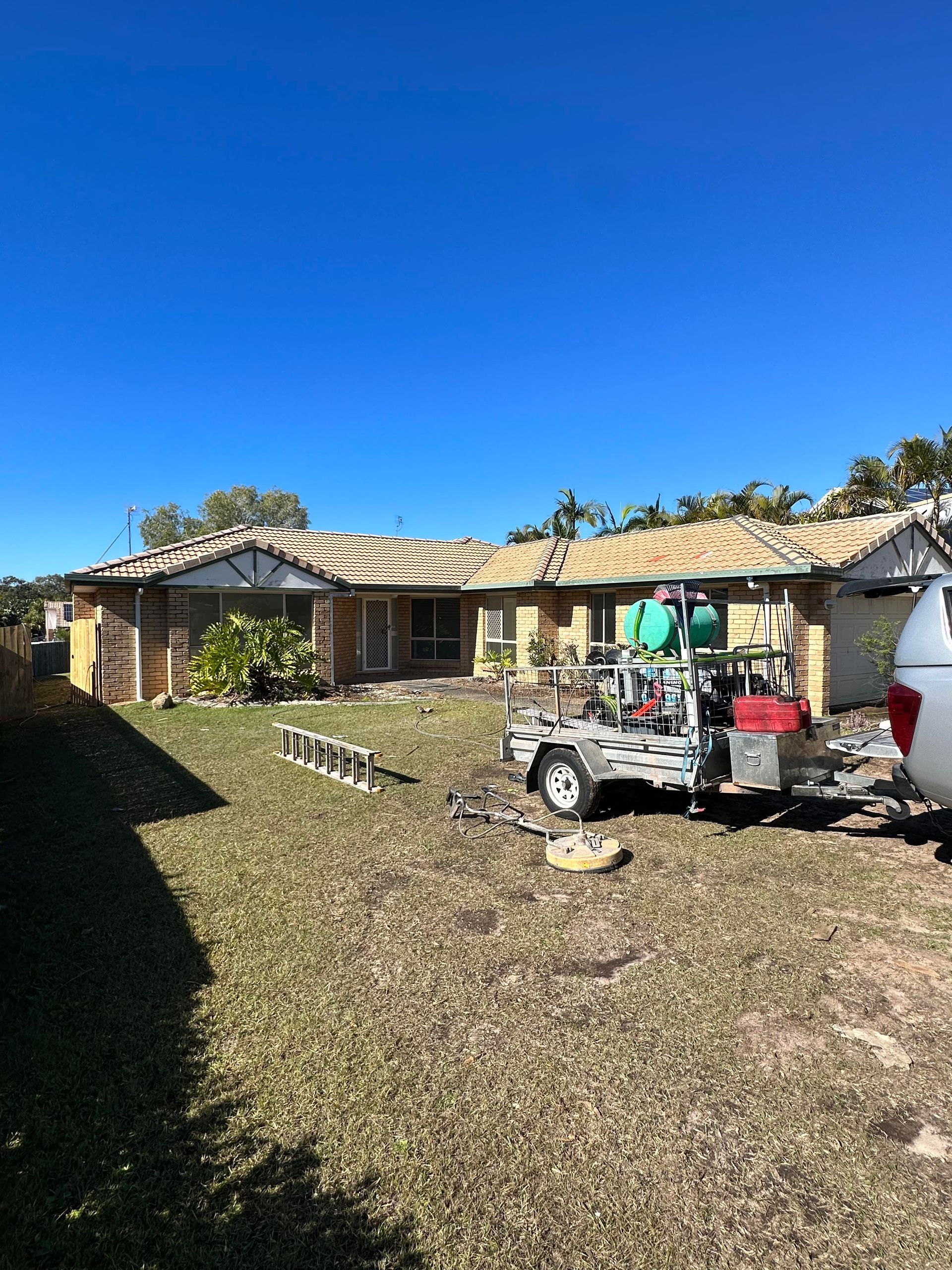 Sandstone Retaining Wall, Light Brown, With Uneven Stone Blocks — Blast It Pressure Cleaning - Gold Coast In Gold Coast, QLD