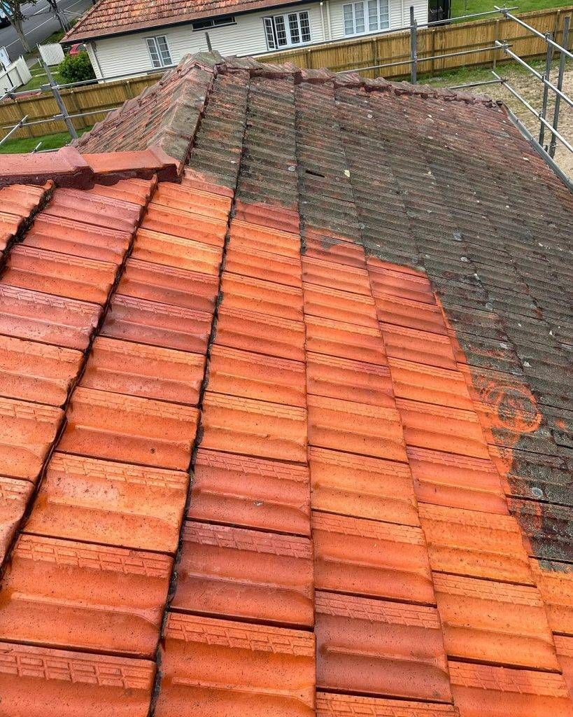 Dirty Red Roof Tiles, Likely During a Roof Repair or Replacement — Blast It Pressure Cleaning - Gold Coast In Gold Coast, QLD