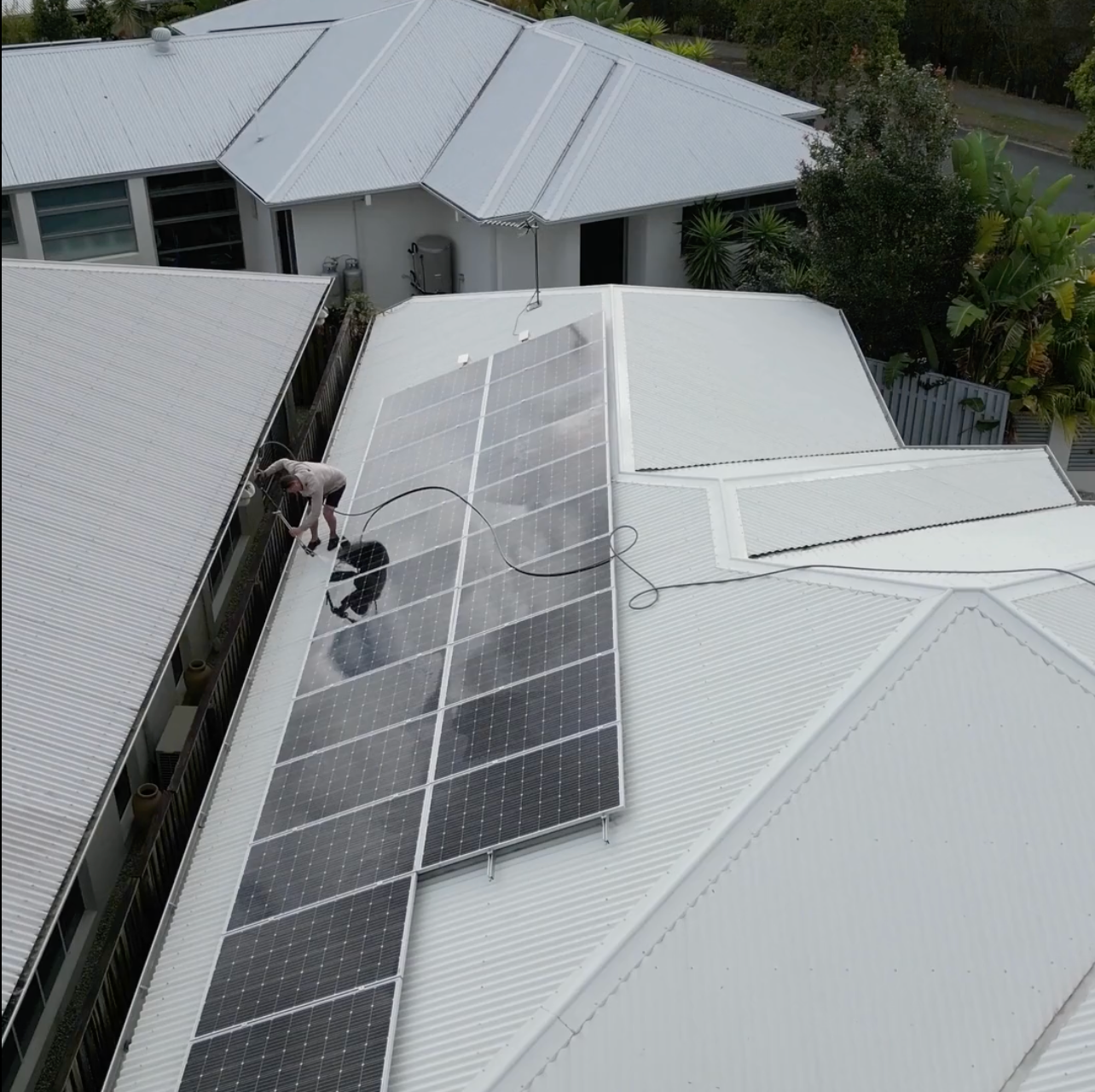 Carrara Family Practice Sign in Front of a Building With Solar Panels — Blast It Pressure Cleaning - Gold Coast In Gold Coast, QLD
