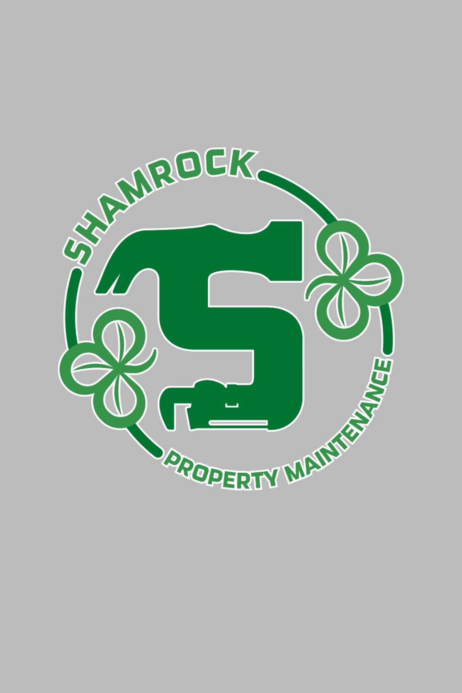 Green Shamrock Property Maintenance logo with a hammer-shaped 