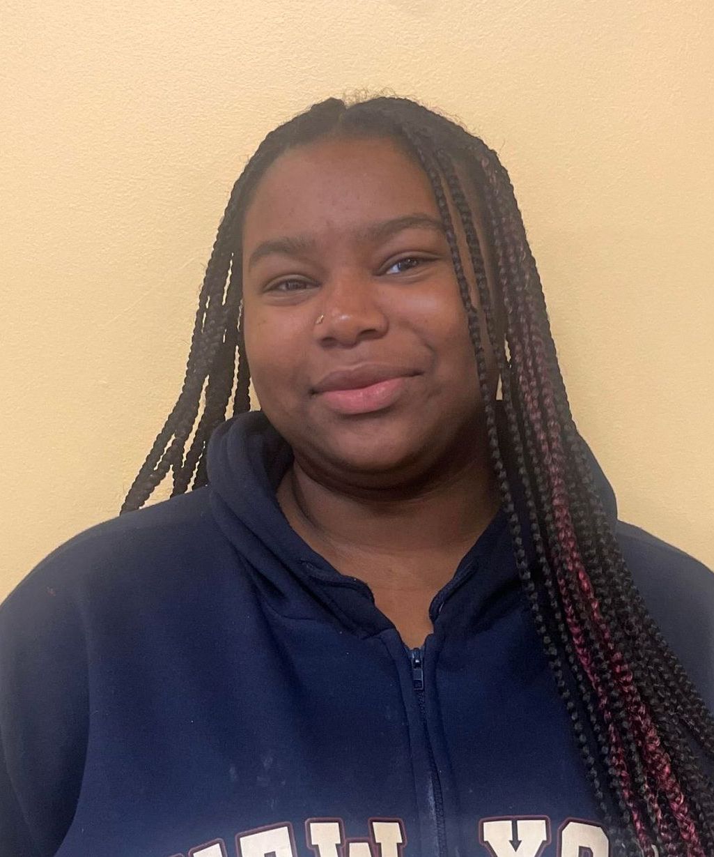 The logo for alameda boys and girls club shows a handshake in a circle.