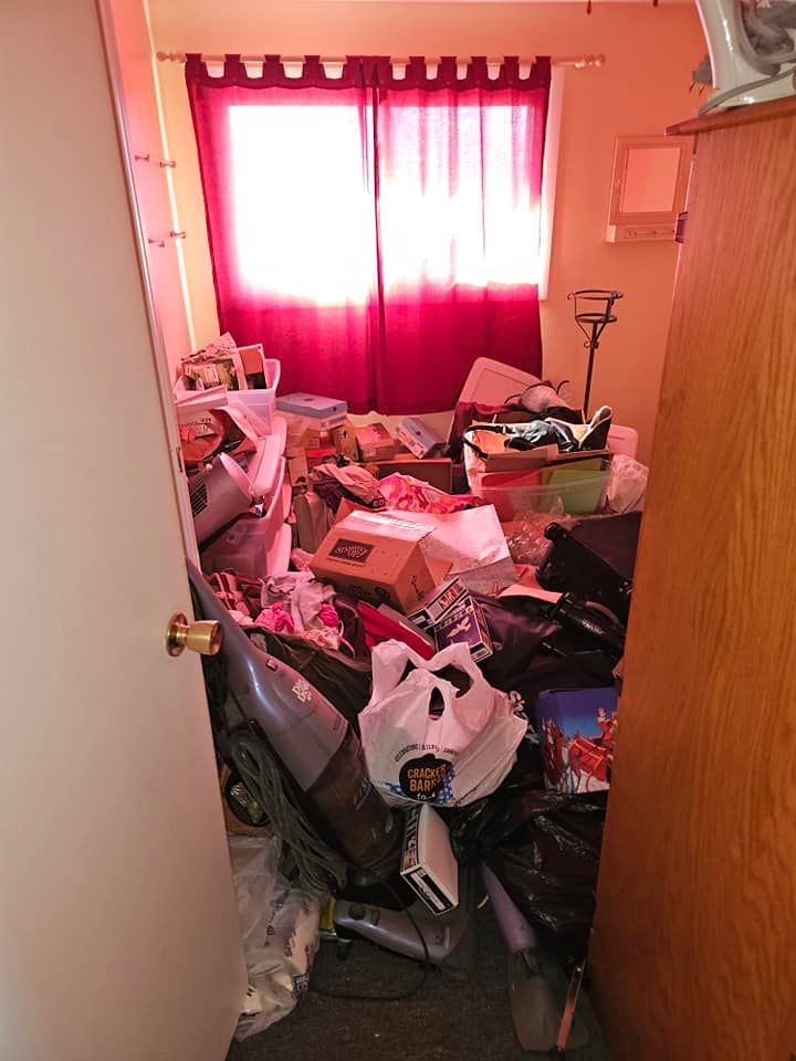 A room with a lot of stuff in it and a window.