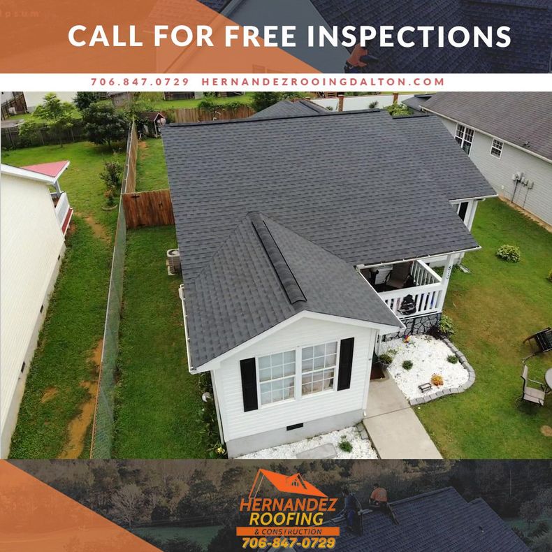 Aerial view of a home with a gray shingled roof, featuring the Hernandez Roofing logo and contact information.