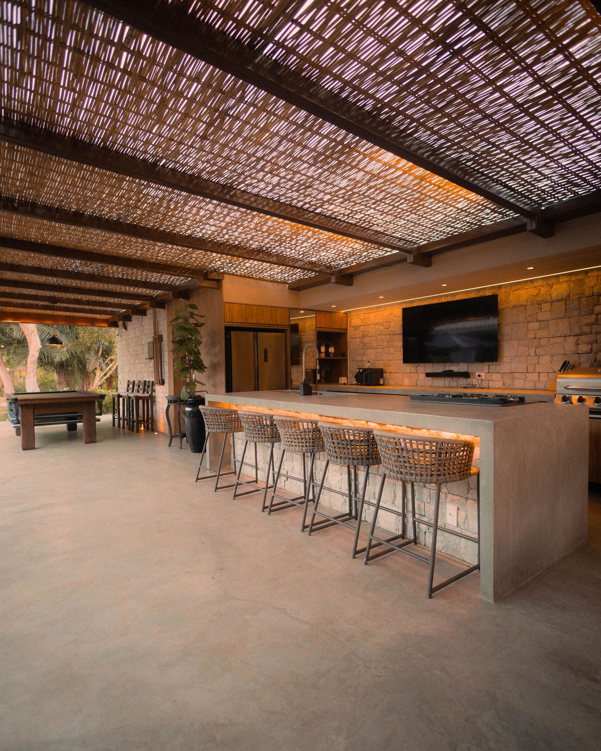 A kitchen with white cabinets , stainless steel appliances , a sink , and a large island.