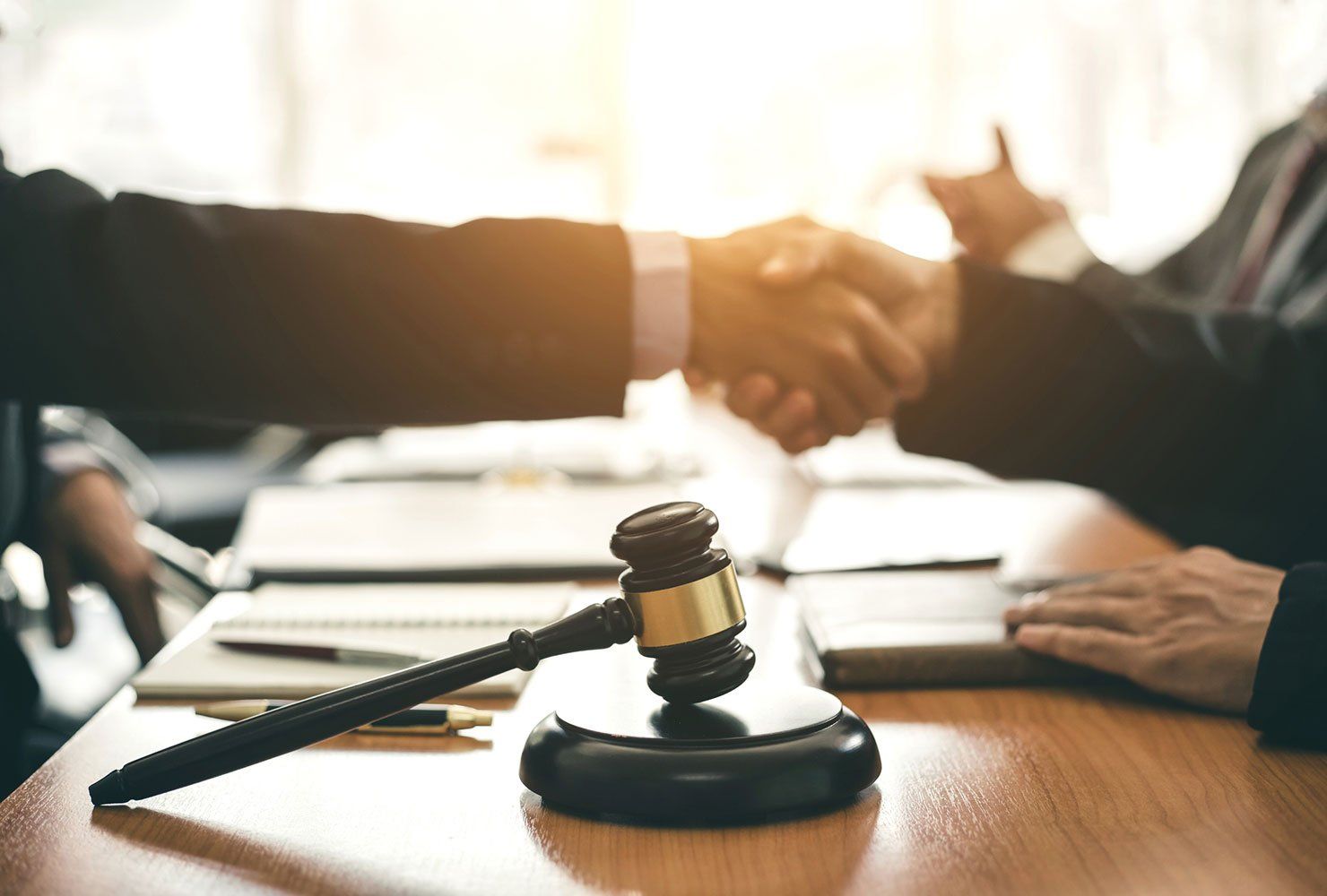 Businessman and Lawyer Shaking Hands to Seal a Deal — Winter Haven, FL — Straughn & Turner, P.A.