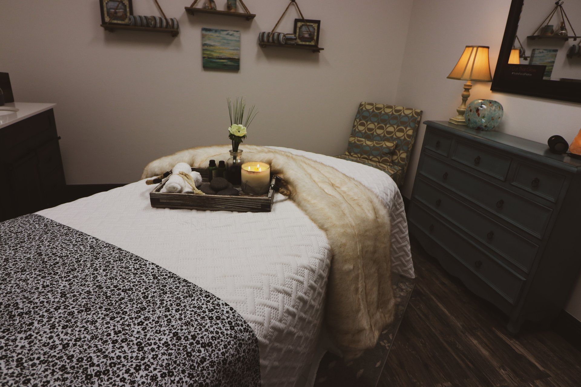A massage table with a tray of candles on it at Results Skincare Studio in Fort Myers