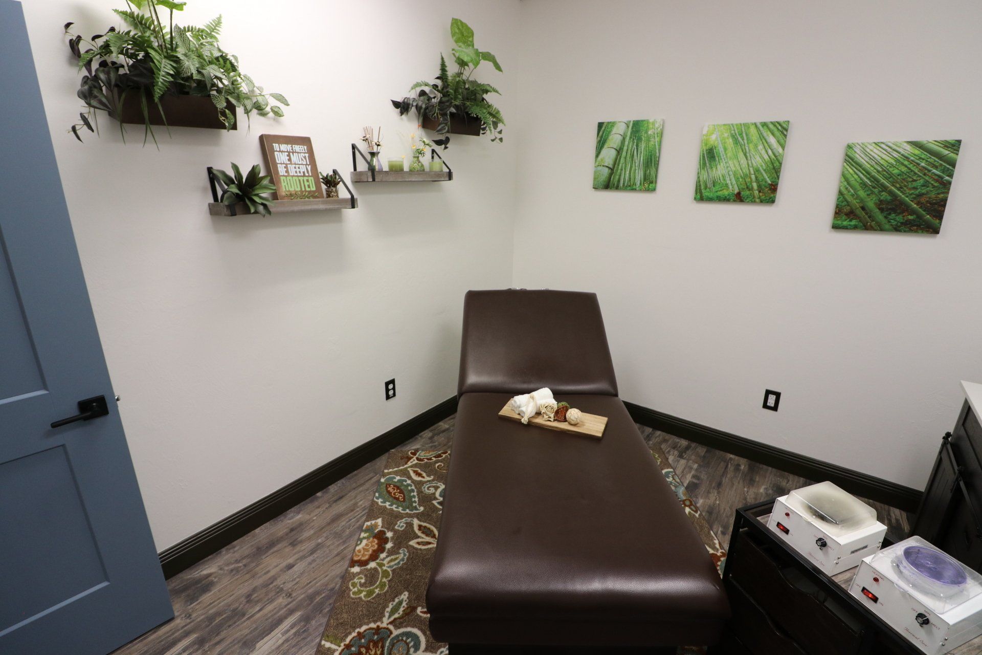A treatment room with patient table at Results Skincare Studio in Fort Myers