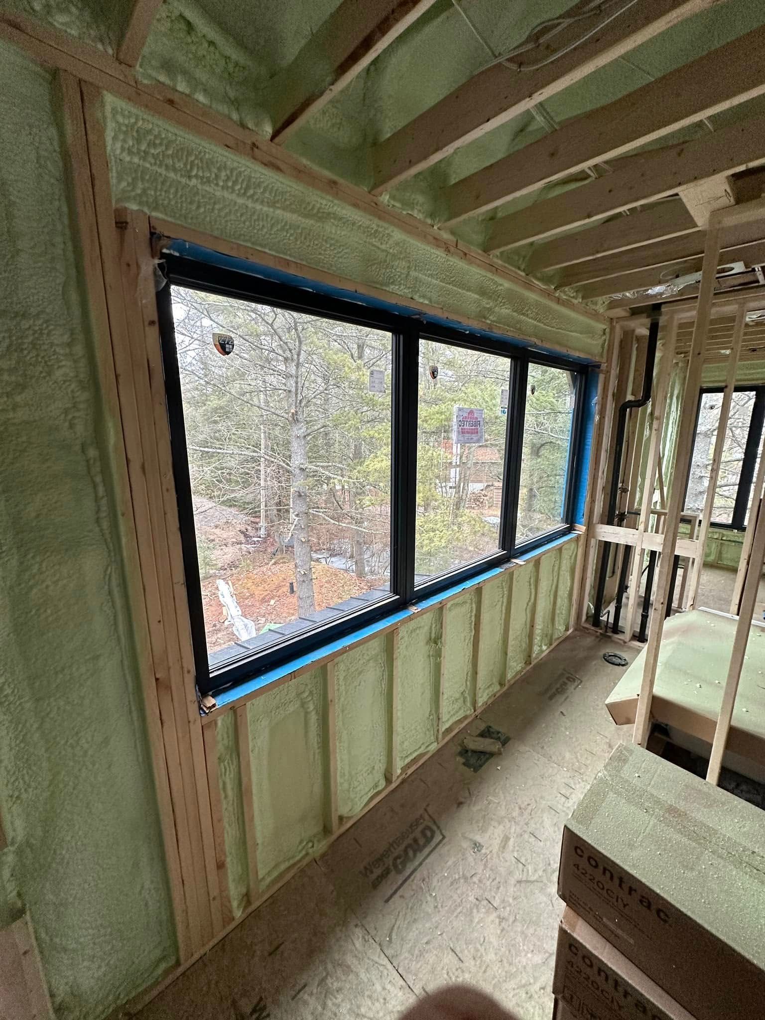 A room with a lot of windows and foam on the wall.