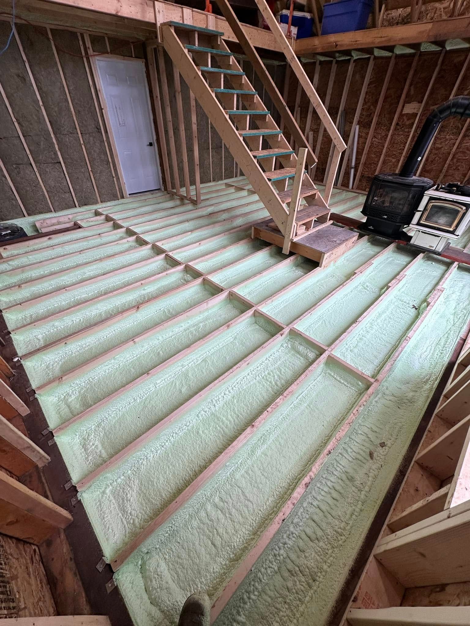 A staircase is being built in the attic of a house.