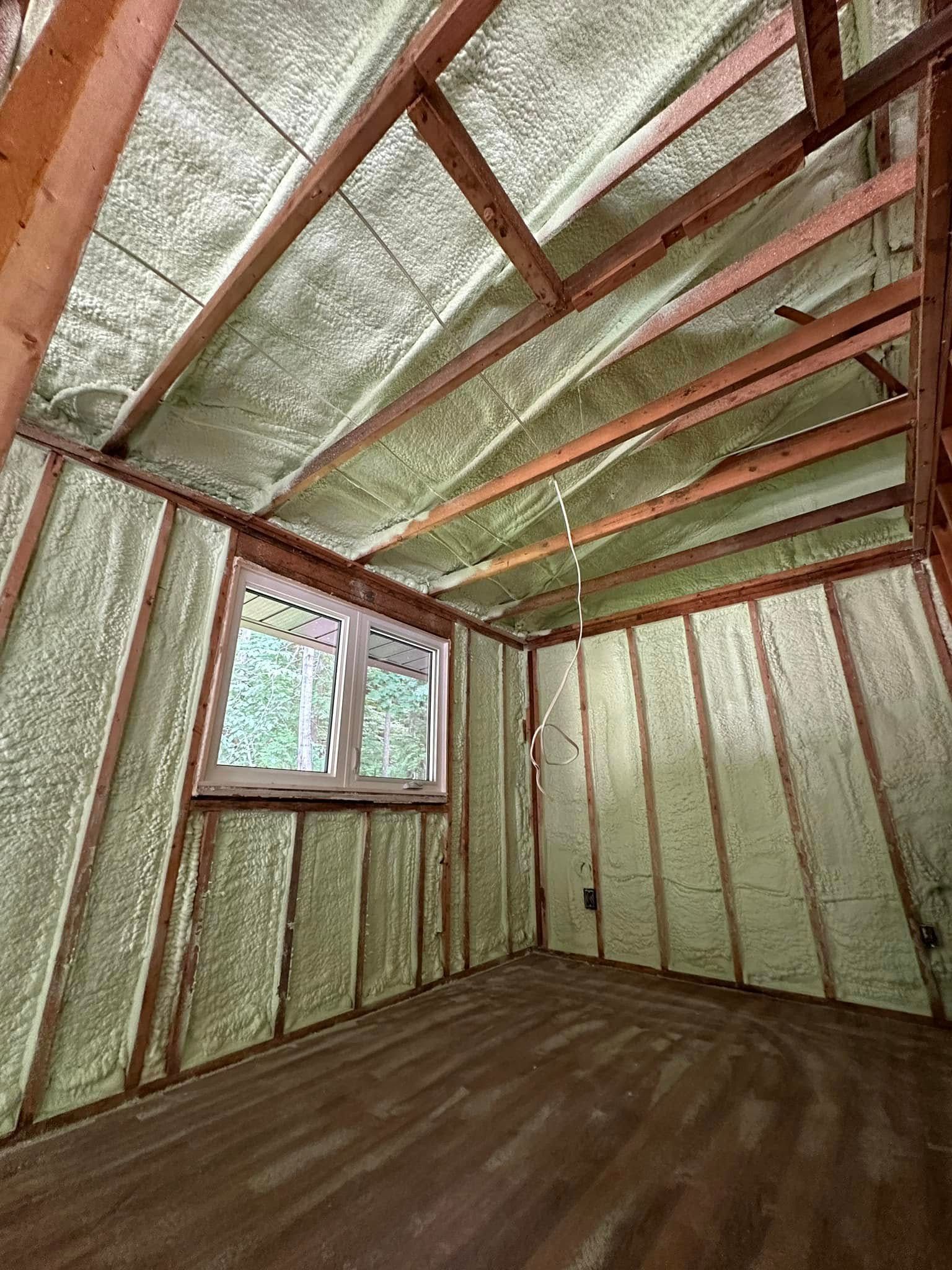 A room with foam insulation on the walls and ceiling.