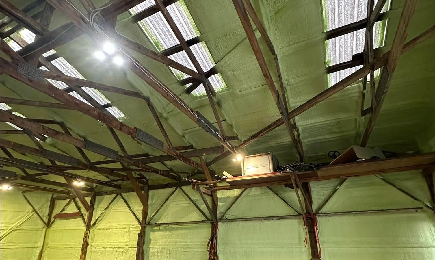The inside of a building with a roof that is covered in foam.