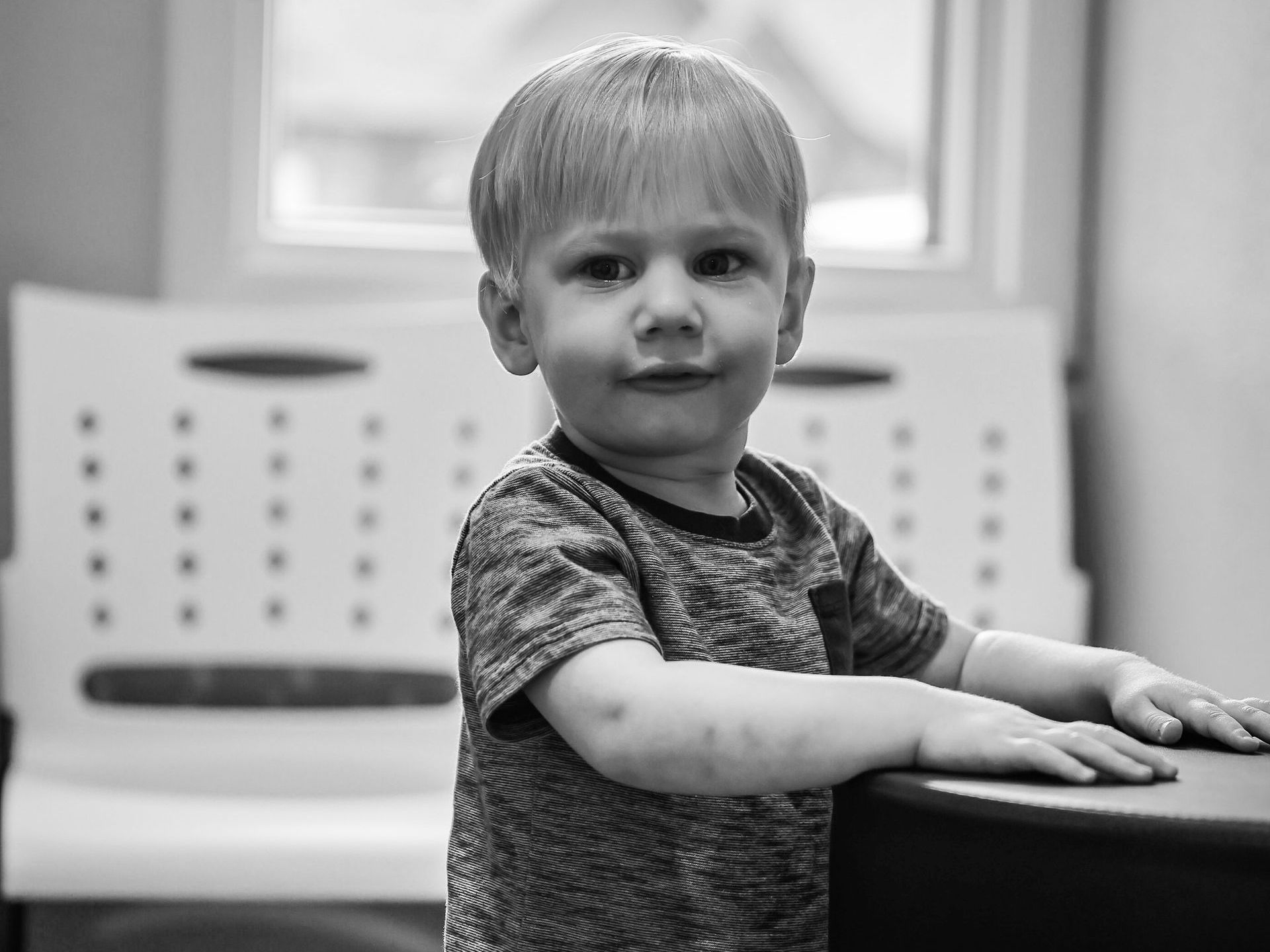 LIttle boy playing at a table