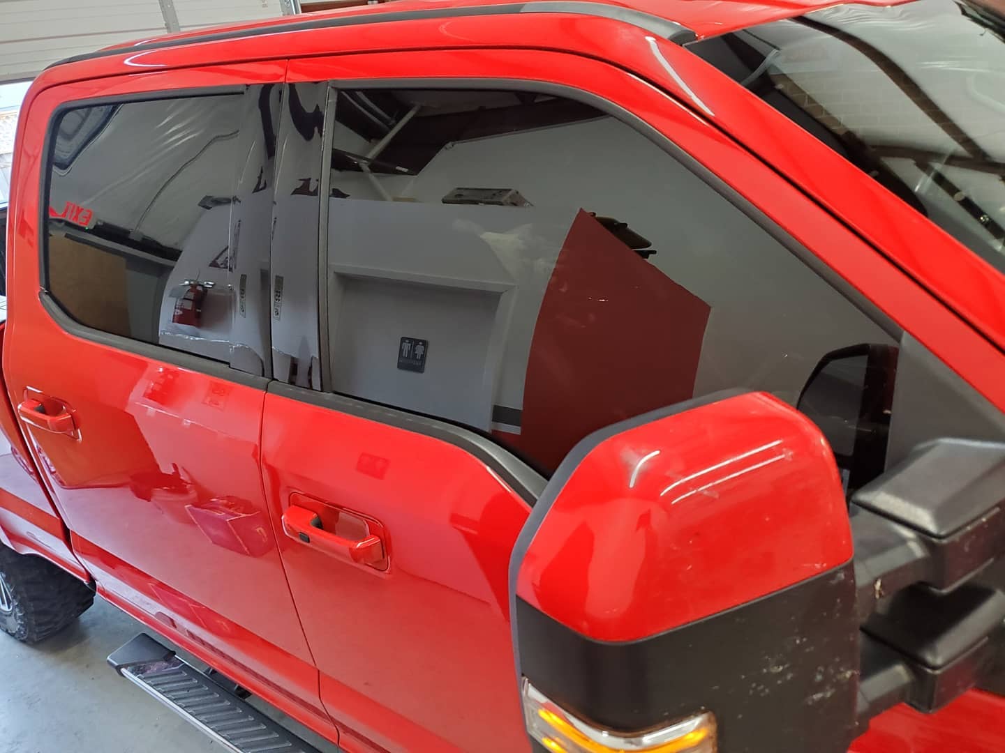 Red Pickup Truck with Tinted Windows — Converse, TX — Quality Master Auto Glass