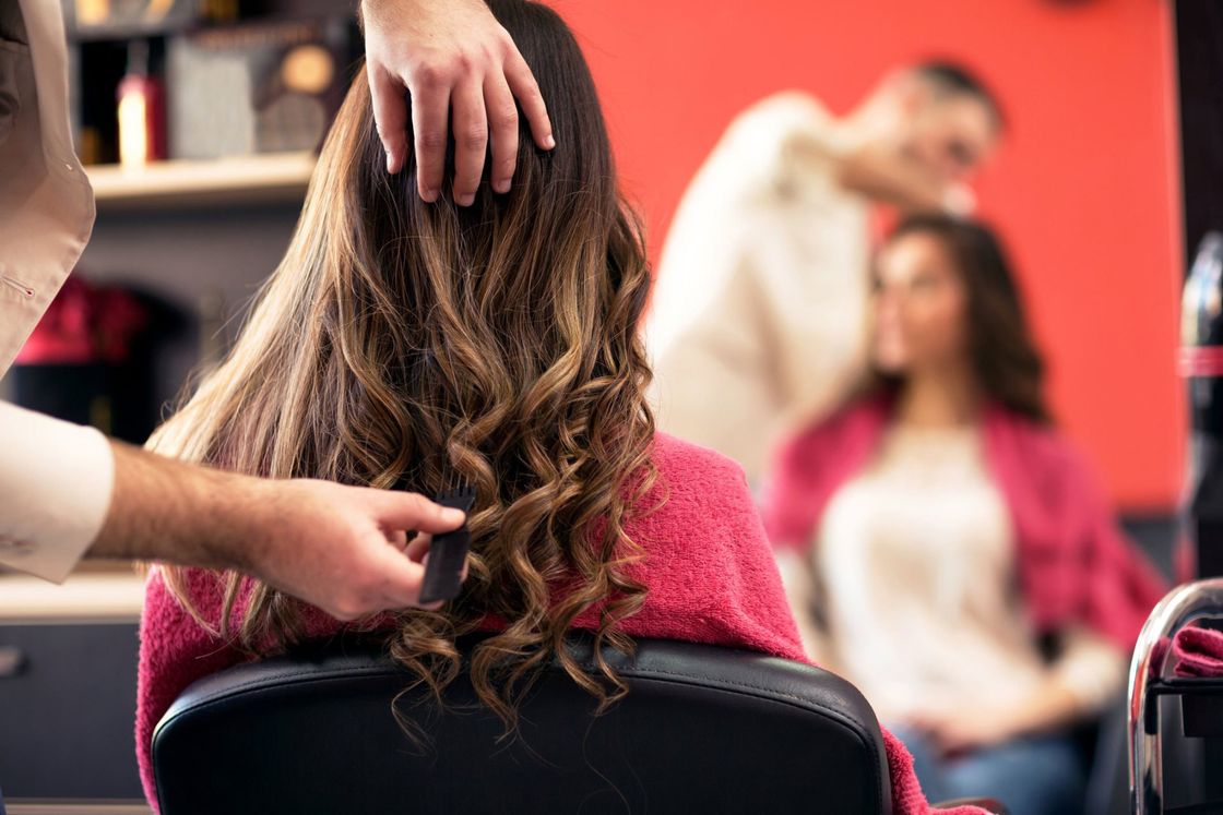 Woman Getting Hair Done — Estero, FL — A Sharper Image Hair Design