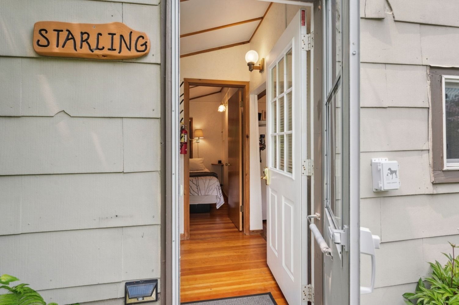 Open doorway of a house labeled 
