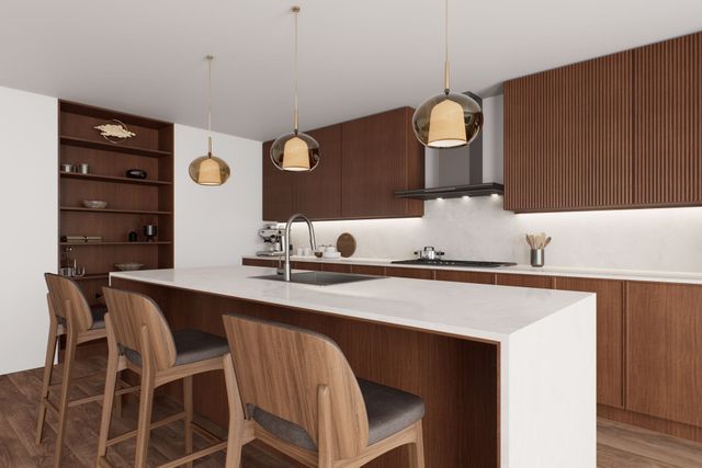 A kitchen with wooden cabinets and a white counter top.
