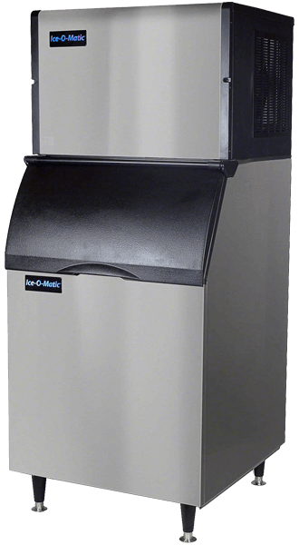 A stainless steel ice machine is sitting on a white surface with a blank background.