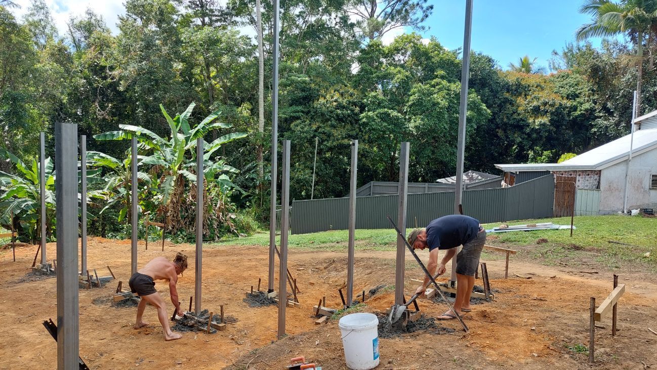 A Group of Men Is Working on A Concrete Driveway — Bunker FNQ in Kuranda, QLD