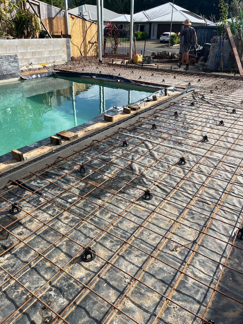 A Little boy Wearing a Hard hat is Playing in the Sand — Bunker FNQ in Kuranda, QLD