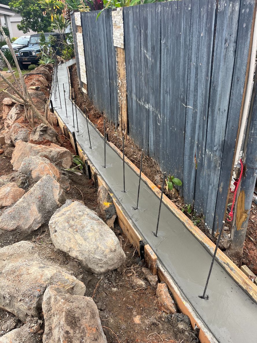A Man Is Pouring Concrete Into a Steel Structure — Bunker FNQ in Kuranda, QLD