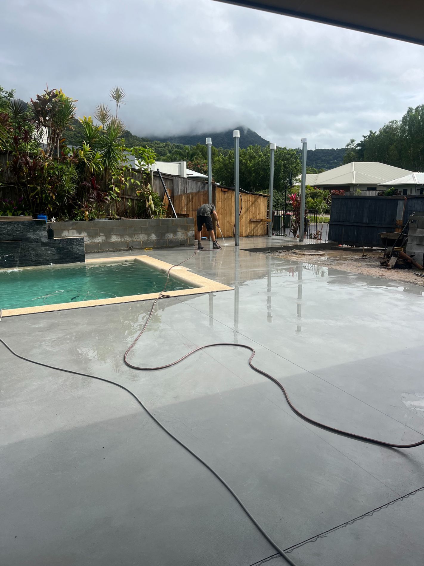 A Group of Construction Workers Are Levelling Concrete with A Level — Bunker FNQ in Kuranda, QLD