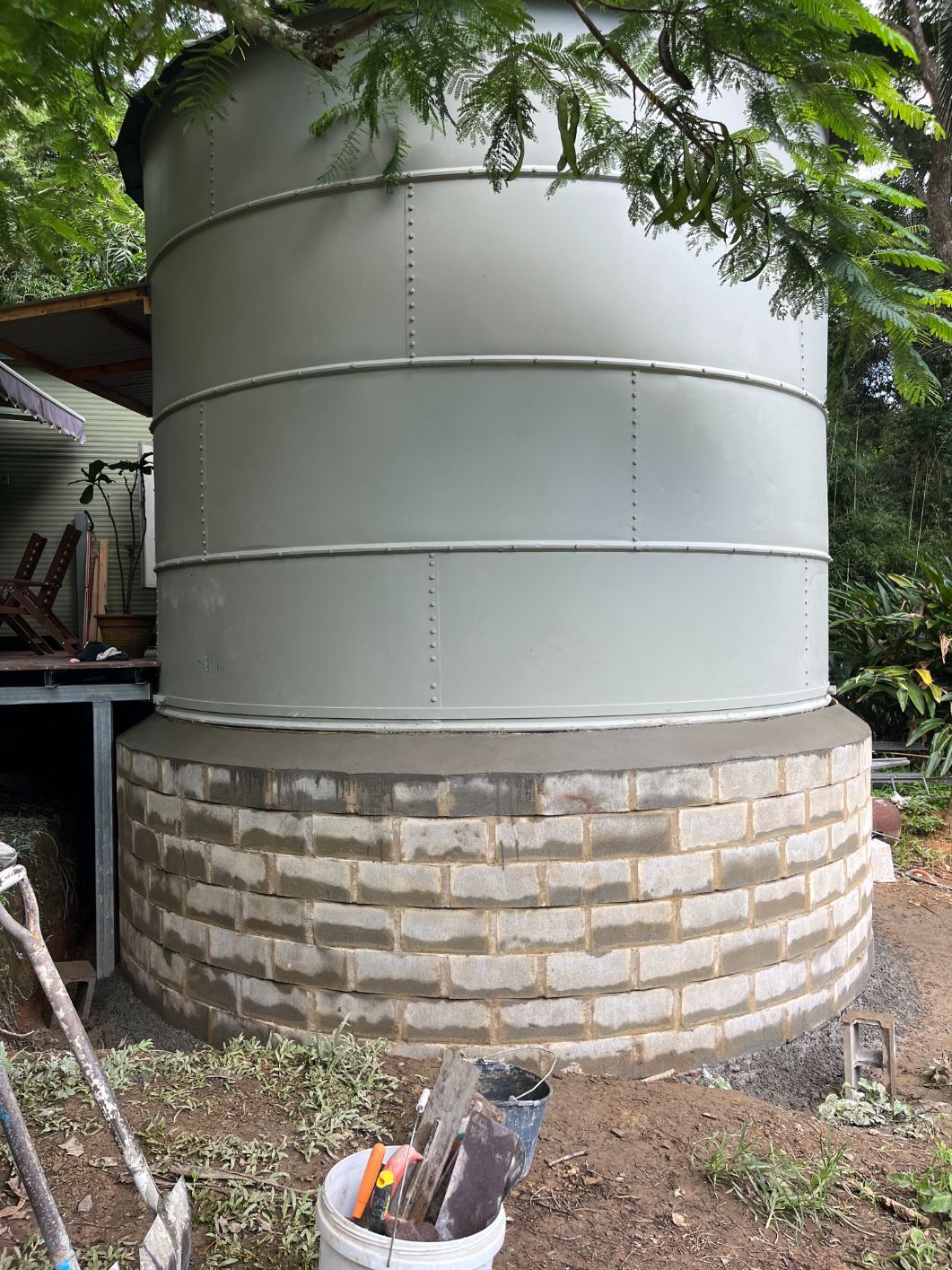 A Group of Construction Workers Are Working on A Concrete Floor — Bunker FNQ in Kuranda, QLD
