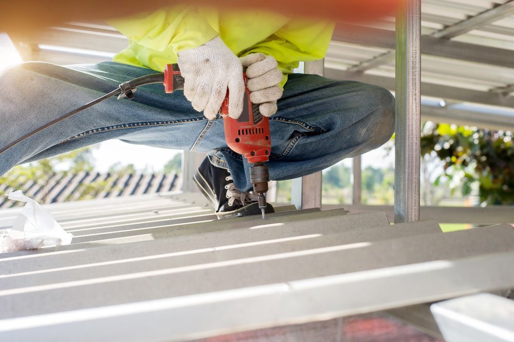 Worker Installing New Roof — Professional Roofer in Alice River, QLD