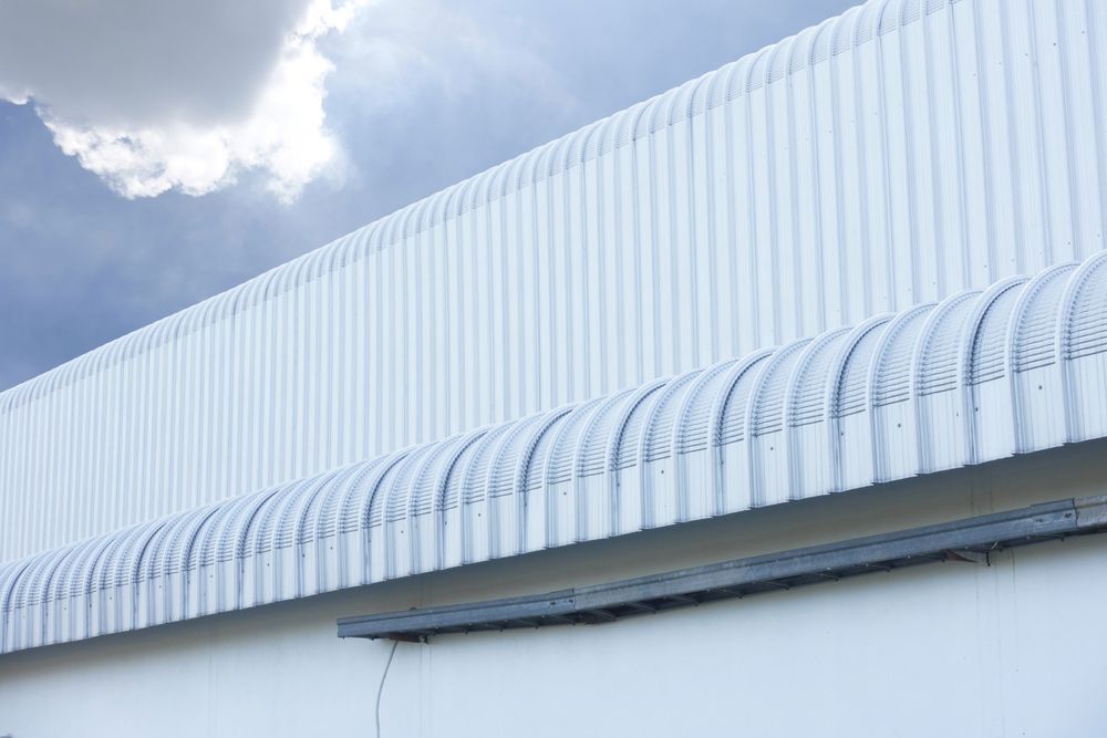 Metal Sheet Roofing Of A Building — Professional Roofer in Alice River, QLD