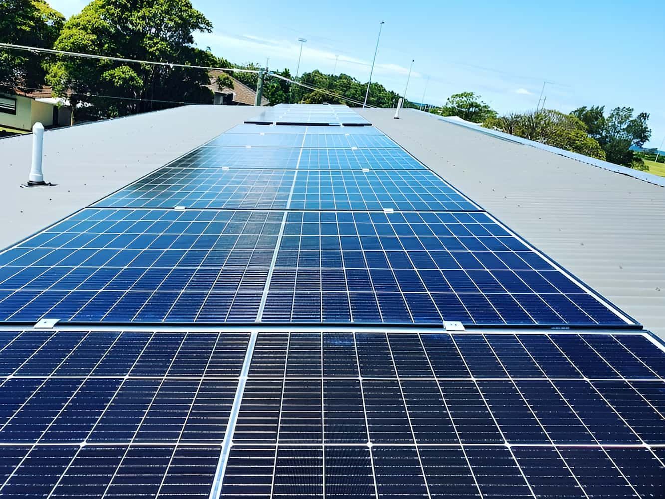 A Row of Solar Panels on the Roof of a Building — SEP Electrical Pty Ltd in Towradgi, NSW