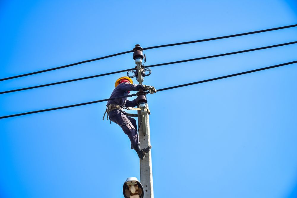 An Electrician is Working on a power line — SEP Electrical Pty Ltd in Towradgi, NSW